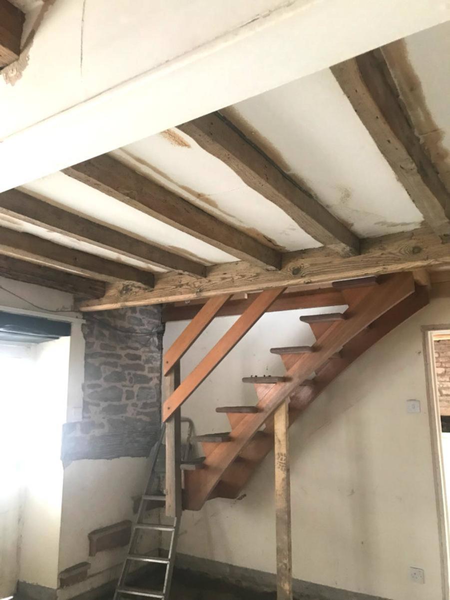 An image of Oak beams restored to their natural state goes here.